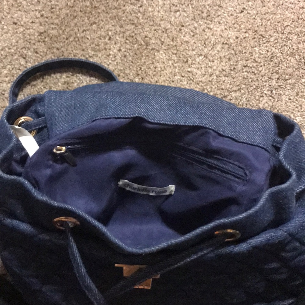A navy quilted mini backpack
